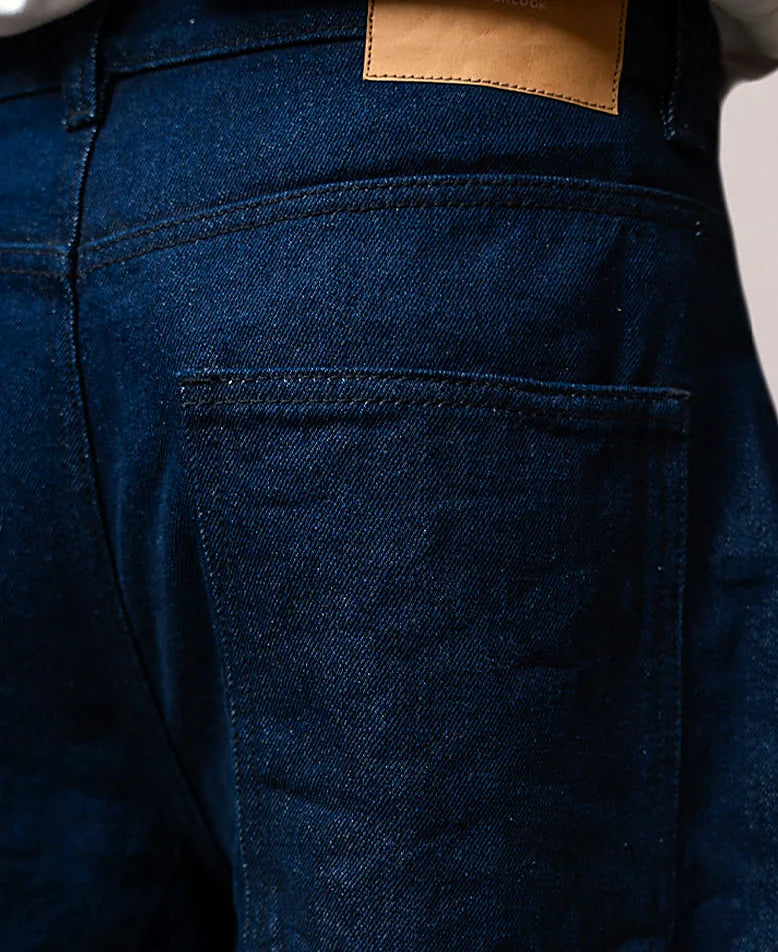 Pair of a neutral tone denim